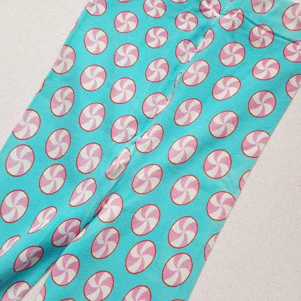 top of tights in pale blue with candy swirl lollipop print