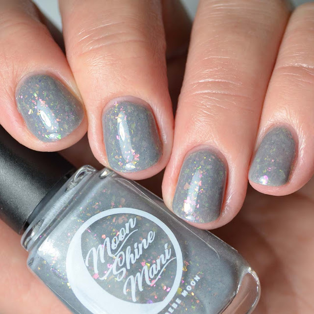 grey nail polish with flakies four finger swatch