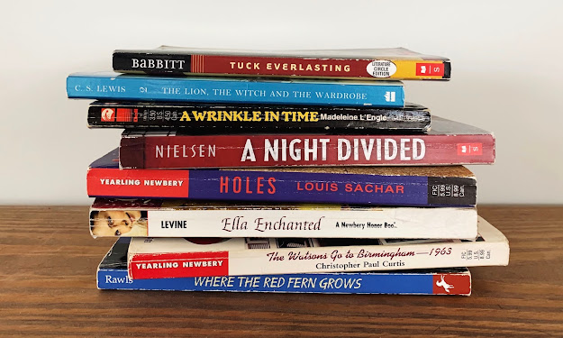 A stack of read aloud novels on a fifth grade level