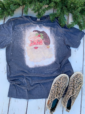 Santa with leopard print hat on bleached tee shirt