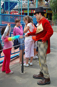 Actor dusting a child's armpit during show at Tibidabo Amusement Park