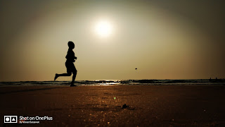 A kid running at beach