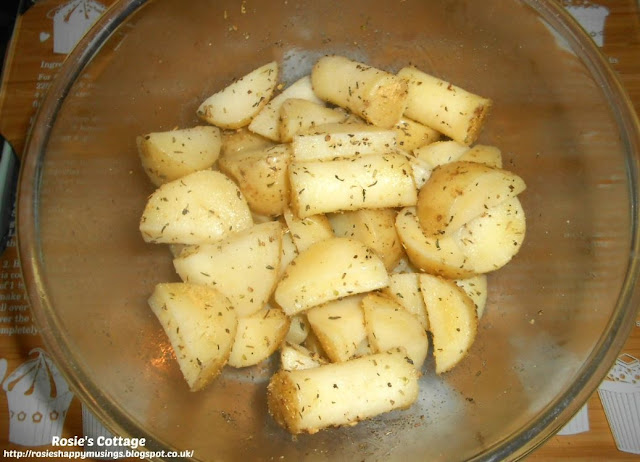 Super Easy Homemade Potato Wedges - Having par boiled your wedges for around 10 minutes, place them into a bowl and sprinkle on your oil and coating.