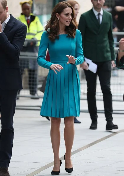 Kate Middleton is repeating her teal Emilia Wickstead dress and her Asprey leaf earrings. Kate is wearing a teal Emilia Wickstead dress