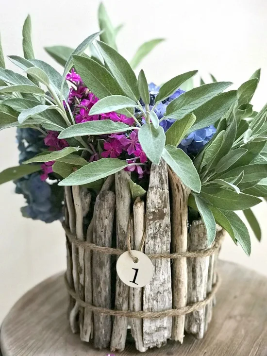 Driftwood vase filled with flowers