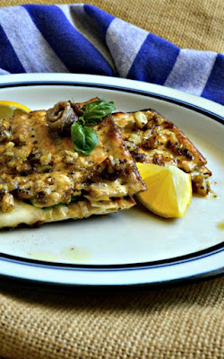 This Matzoh Grilled Cheese is made with a basil, lemon, garlic and anchovy sauce. It will knock your socks off and don't knock it until you've tried it! #grilledcheese #Passoverrecipes #sandwich www.thisishowicook.com