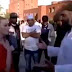 British girl in a red dress harassed by Muslim woman for not wearing Burqa