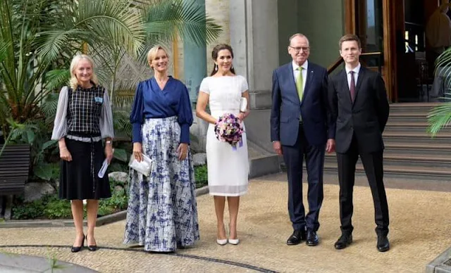 Crown Princess Mary wore a white dress by David Andersen, and snowdrop earrings by Dulong Fine Jewelry