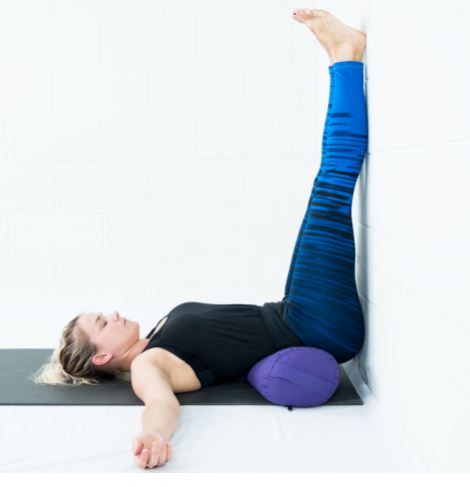 Foot-up-wall-yoga-posing