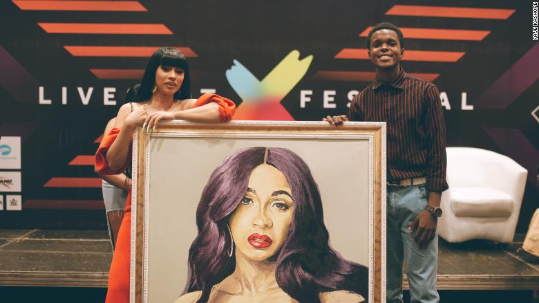 191209115910 cardi b receives painting from nigerian artist exlarge 169