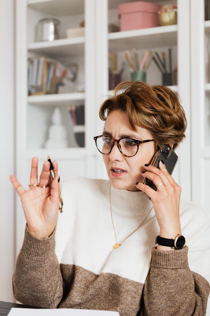 A tensed woman representing the dissatisfaction in the workplace.