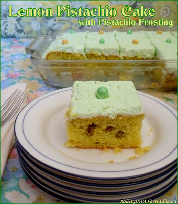 Lemon Pistachio Cake with Pistachio Frosting starts with an enhanced cake mix, is studded with pistachios and topped with a Pistachio Whipped Cream frosting. | Recipe developed by www.BakingInATornado.com | #recipe #cake