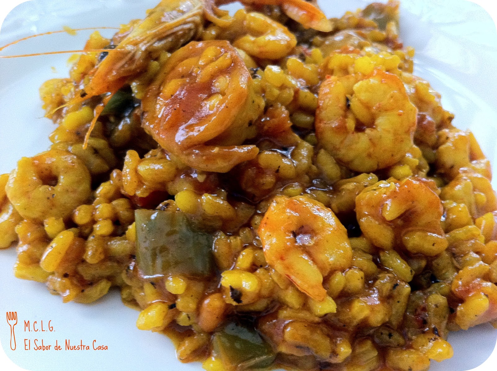 EL SABOR DE NUESTRA CASA ARROZ CON GAMBAS Y CALAMARES
