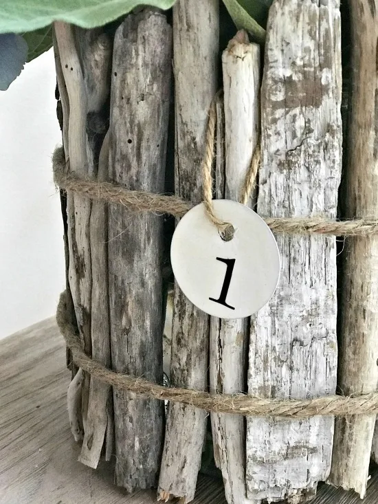 Driftwood vase with jute wrap and enamelware tag