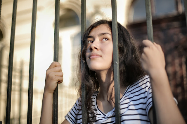 girl behind bars