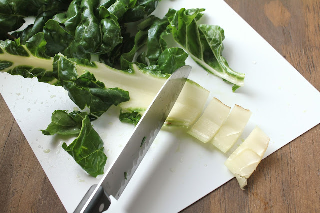 Chopping the Stem of Swiss Chard chopping stem of swiss chard with knife