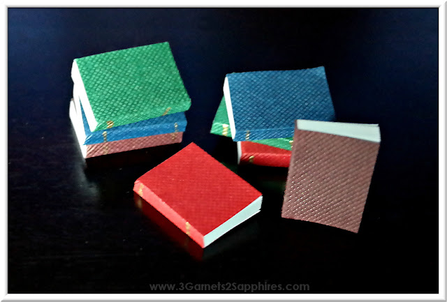 Tutorial for a set of DIY dollhouse miniature books based on your favorite book series.  www.3Garnets2Sapphires.com