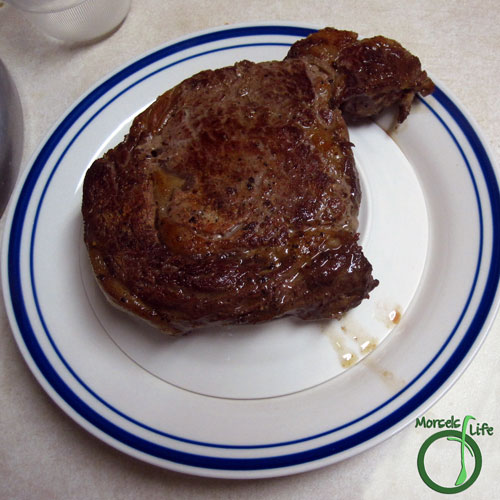 Morsels of Life - Steak Step 6 - Stack a small place upside down inside a larger plate, and place the steak on top of both plates.