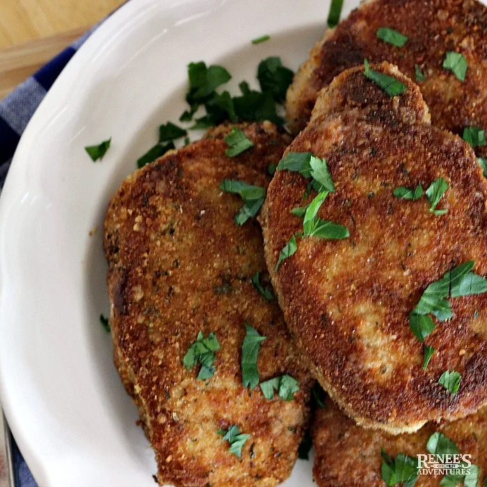 Breaded Oven Baked Pork Chops on a white plate