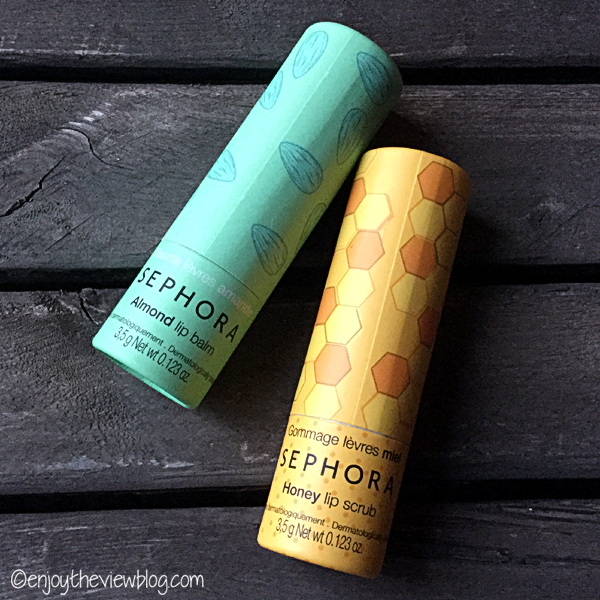 A tube of Sephora Almond lip balm and Honey exfoliating lip scrub lying on a wooden table