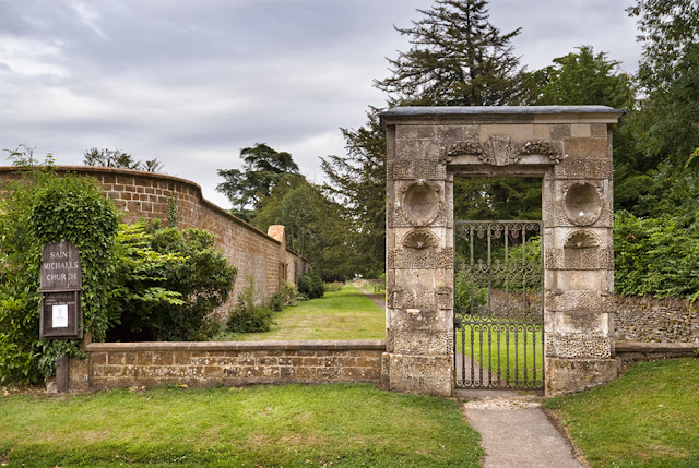 17th-century gateway leading to St. Michael's parish church in Great Tew by Martyn Ferry Photography