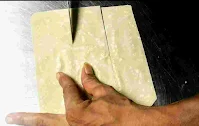 Cutting and making samosa patti with a knife