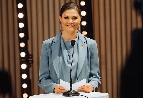 Crown Princess Victoria wore a Narina blazer, Rosaria trousers and Volon mist blue silk top, blouse from Tiger of Sweden