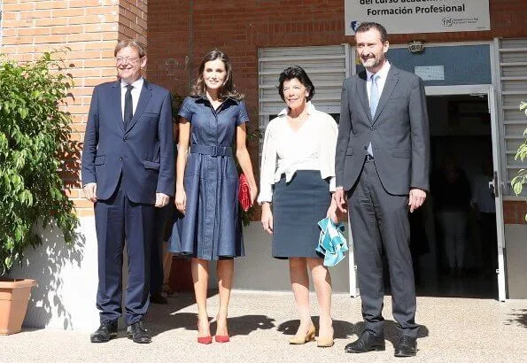 Queen Letizia wore Carolina Herrera denim shirt dress. Carolina Herrera clutch. President Ximo Puig