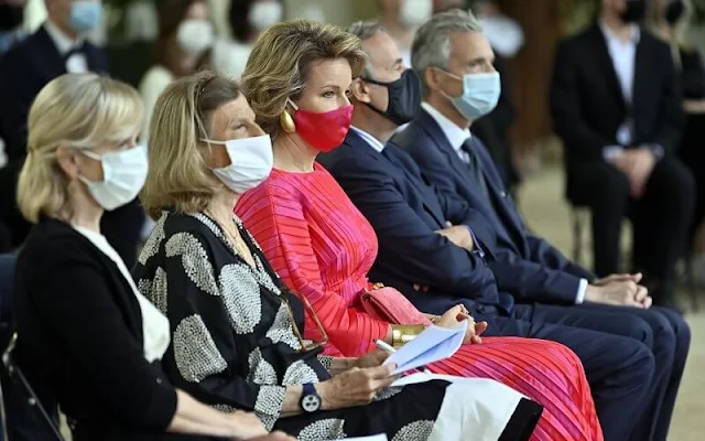Queen Mathilde wore a new flare pleated red midi dress from Natan. Delphine Nardin gold earrings. Tikli Jewelry gold bracelet