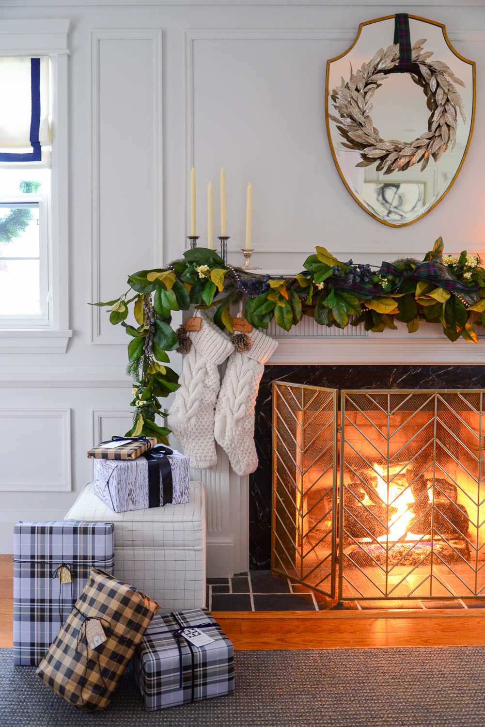 christmas fireplace mantel garland with magnolia garland and candlesticks