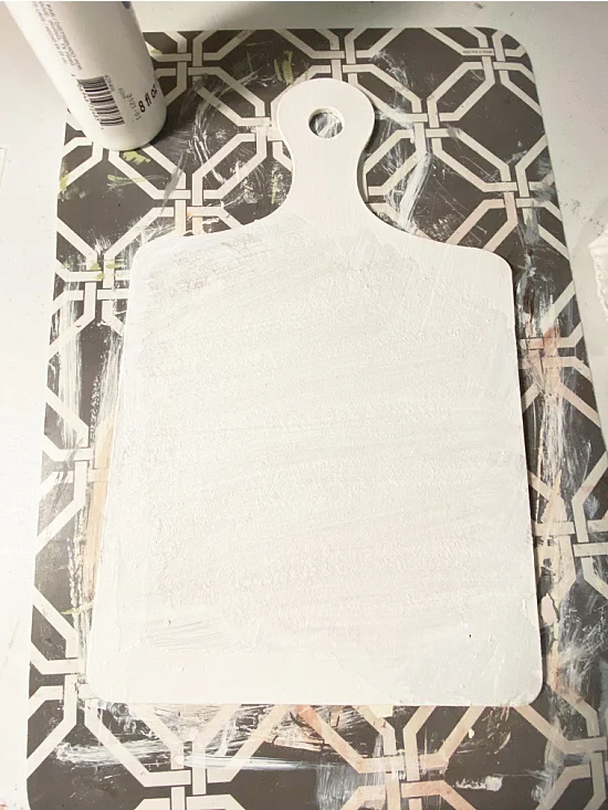 white painted cutting board sign