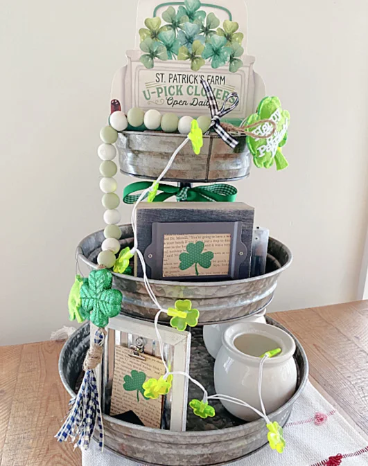 tiered tray filled with St. Patrick's Day decor
