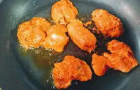 Cooking chicken pieces on Non stick pan or tawa for chicken Tikka