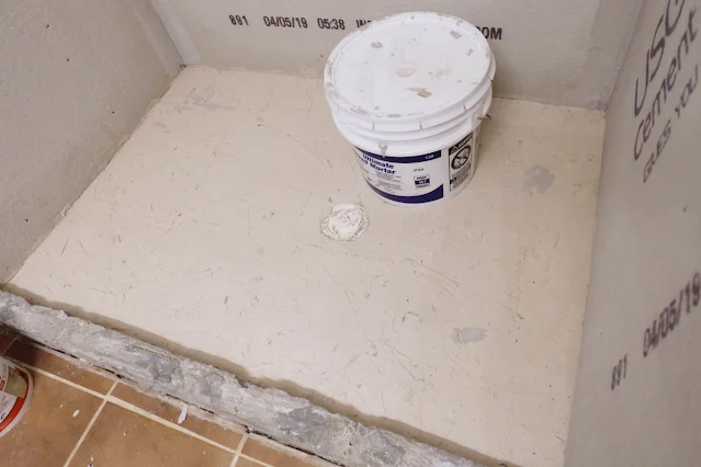 patching concrete shower floor pan with skim coat