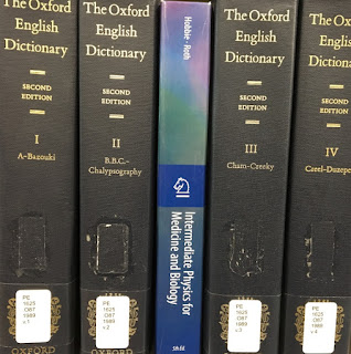 Intermediate Physics for Medicine and Biology nestled among volumes of the Oxford English Dictionary.