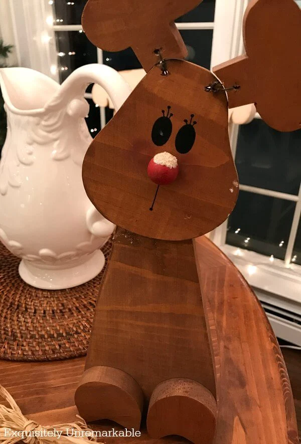 Wooden Reindeer In Need Of Repair on kitchen table