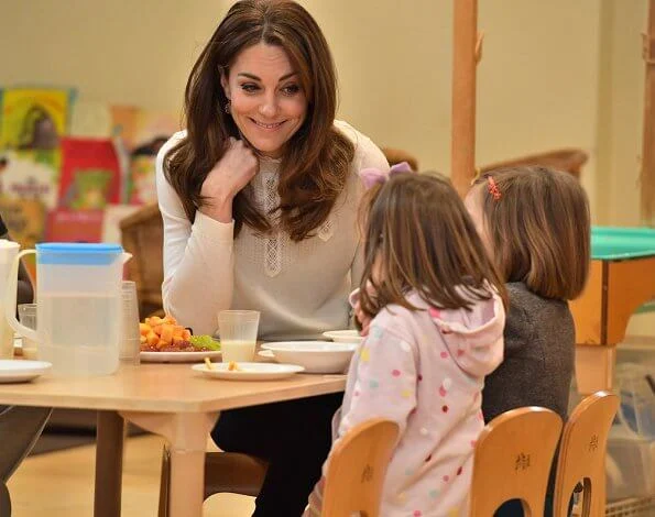 Kate Middleton wore Sezane Tulio jumper, Russell and Bromley FAB Dry ankle boots, Accessorize Filigree gold earrings, a blue wool coat