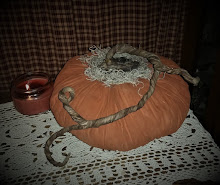 LARGE PRIMITIVE PUMPKIN WITH TRAILING VINE