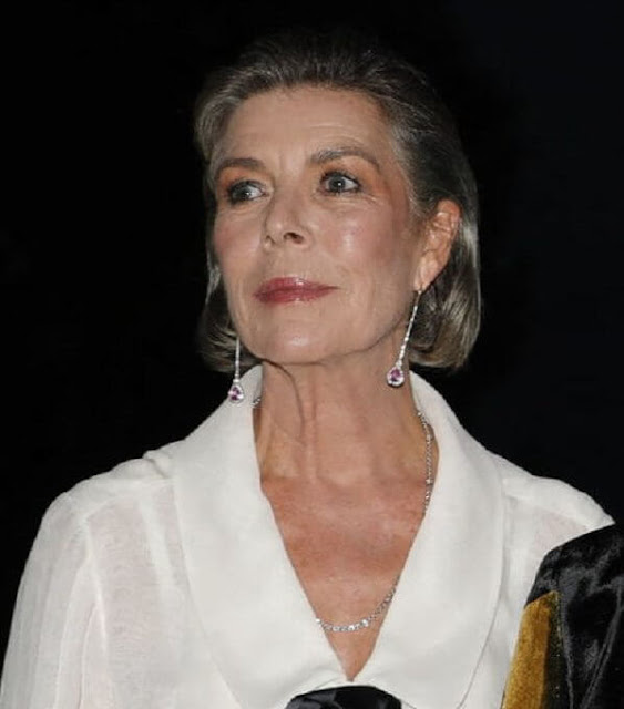 Princess Caroline of Hanover wore a floral print pleated skirt and white silk blouse from Chanel