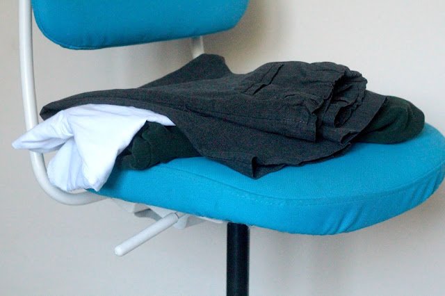 clothes folded on a chair