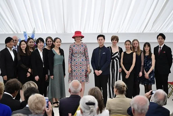 Queen Mathilde wore Natan print dress. Winner of the Queen Elisabeth Competition Stella Chen and Queen Mathilde