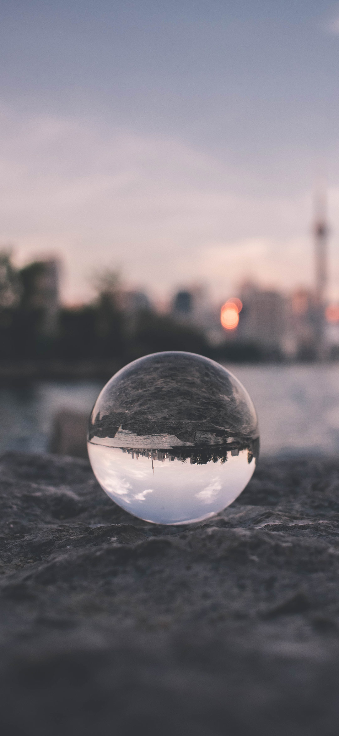 Glass-ball-on-gray-sand-wallpaper
