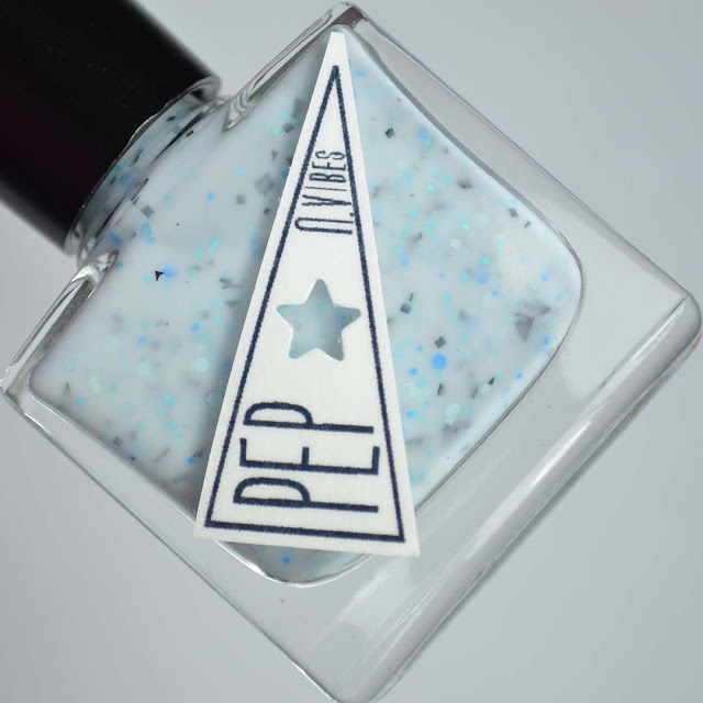 white nail polish with blue and black glitter