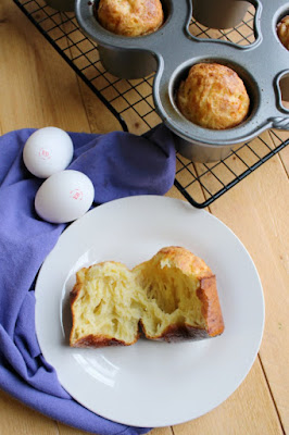 Fluffy, cheesy, eggy airy popovers are a thing of beauty. Top with some herb butter or fruit preserves for an extra special treat. white cheddar popover on plate with eggland's best eggs in nordic ware popover pan in the background
