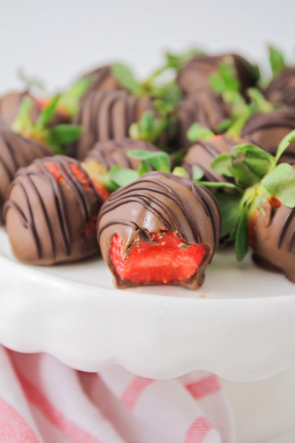 These homemade chocolate covered strawberries are so easy to make and so delicious! They're the perfect romantic dessert for Valentine's Day!