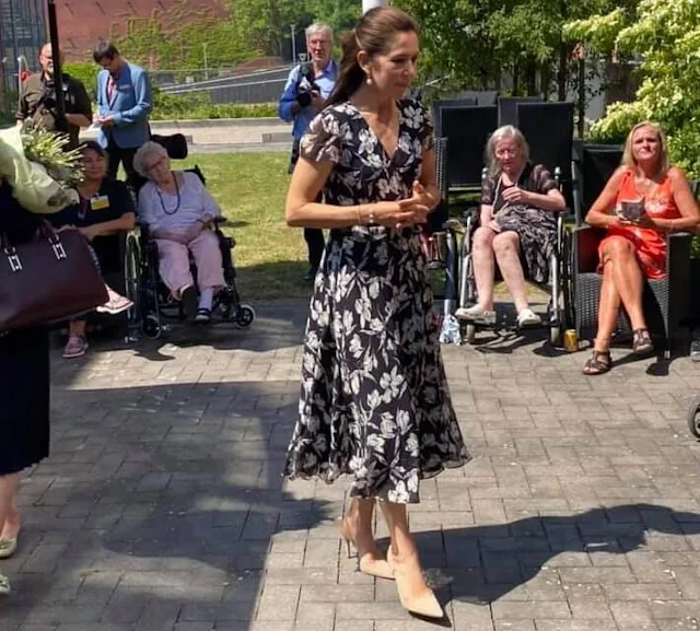 Crown Princess Mary wore a new floral wrap dress from Ralph Lauren, and Gianvito Rossi pumps, Dulong Esme bracelet, Cartier Love Bracelet