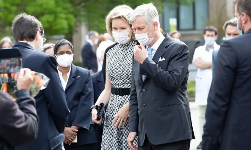 Queen Mathilde wore a new sleeveless houndstooth midi dress from CH Carolina Herrera, and houndstooth toe pumps from Carolina Herrera