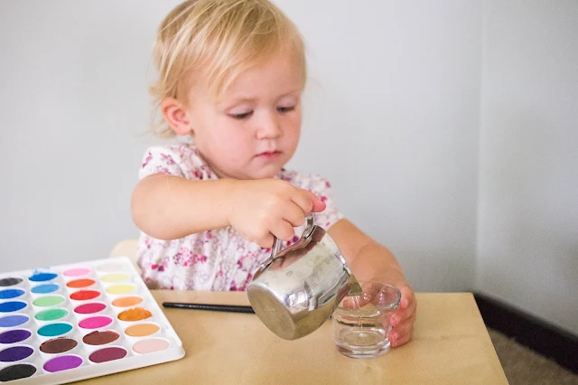 20+ Montessori ways to play with water with your child in your home - practical life ideas including water.
