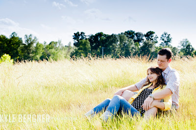 Portrait of couple sitting in tall grass at Fox Hill Park in Bowie Maryland