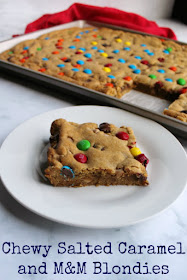 Chewy brown sugary blondies loaded with chocolate chunks, caramel undertones and topped with M&Ms. This big batch of bars is perfect for a party, carry-in or just because. Chewy brown sugary blondies loaded with chocolate chunks, caramel undertones and topped with M&Ms. This big batch of bars is perfect for a party, carry-in or just because.